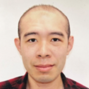 EMPH Student Alvin Wong wearing red and black checkered top, standing indoor against a white background